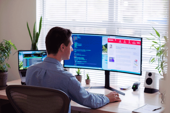 A man working on his computer at home