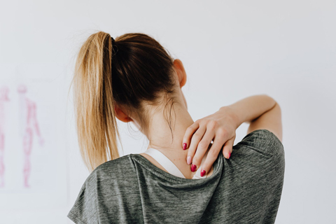Woman showing a painful spot at doctor’s office